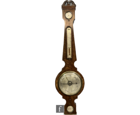 A 19th Century mahogany wheel barometer by Marks's &amp; Co Peterborough, incorporating thermometer and dry/damp dial, height