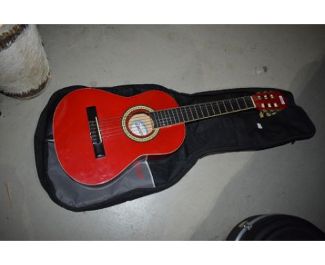 A Guvnor junior sized acoustic guitar , model GC102RD, with Stagg gig bag