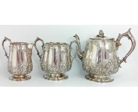A Victorian silver tea service by Elkington and Co., to include a teapot with flower bud finial and ivory insulators, a milk 