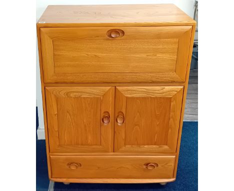 An Ercol elm bureau, with drawer and cupboard to lower section with adjustable shelf, drop flap space to top, on castors, wid