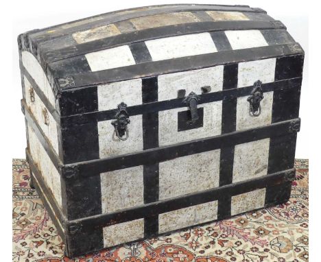 An early 20th century painted canvas, wood and metal bound domed hinge topped travelling trunk, w.82cm 