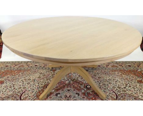 A contemporary Neptune blond oak circular breakfast table, raised on pedestal base, dia. 150cmTop of table is a little faded 