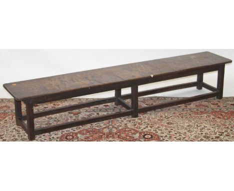 A rustic oak long work bench, length 176cmHeight 32cm. Depth 33cm.