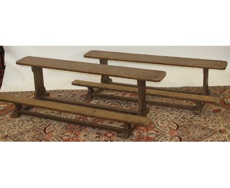 A pair of stained pine rustic two-tier long bench seats, w.150cm