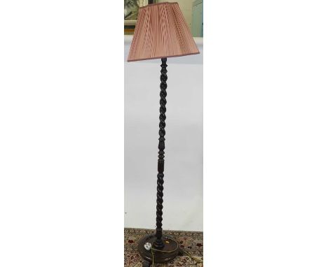 A stained and spiral turned beech standard lamp 