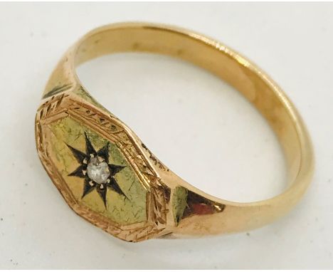 An unmarked gold (possibly 14ct) gentleman's ring set with a diamond. Weight 4.6g