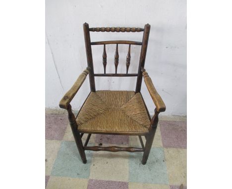 A country rush seated chair with bobbin turned detailing