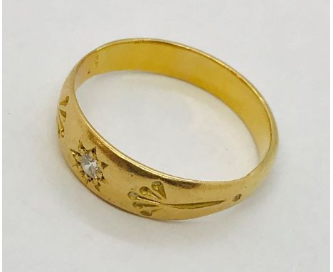 An unmarked gold (probably 18ct) gentleman's ring set with a single diamond. Weight 3.6g
