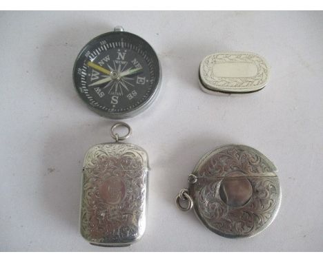 A hallmarked silver vesta along with round silver card case, snuff box and compass