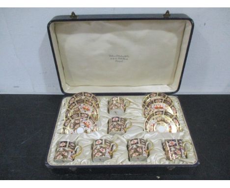 A cased set of Royal crown Derby Imari pattern coffee cans and saucers