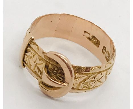 A 9ct rose gold buckle ring. Weight 3.2g