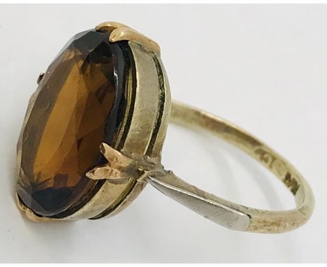A 9ct gold ring set with a smoky topaz