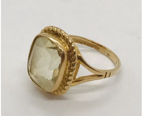 A 9ct gold dress ring set with a topez