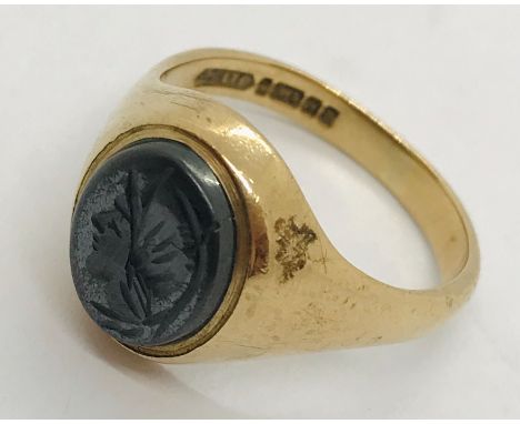 A 9ct gold gentleman's signet ring. Weight including stone 6.2g