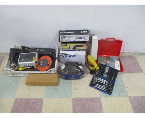 A collection of various power tools, tools and accessories including a hammer drill, sander, electric planer, drill bits, ang