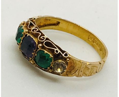 A Victorian 15ct gold ring set with Suffragette coloured stones.