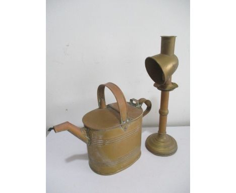 A brass watering can, stamped Army &amp; Navy to underside along with a brass candlestick with shade