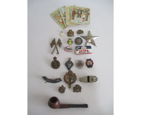 A collection of badges, silver medallion, pipe, Acme Thunderer etc.
