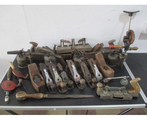 A collection of various woodworking planes, tools etc.