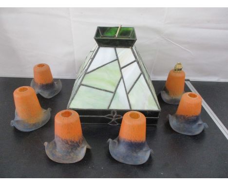 A Tiffany style central light, along with a set of six decorative glass shades