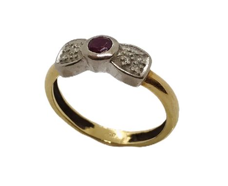 An 18ct gold bow shaped ring with ruby and diamonds