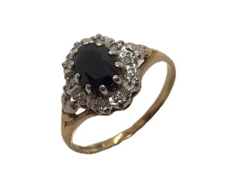 A 9ct gold ring with sapphire and diamonds