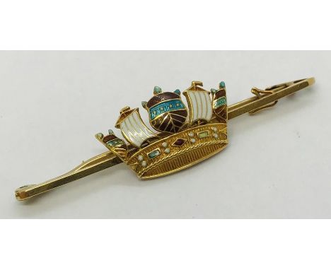 A 15ct gold and enamel brooch. Weight 4.5g