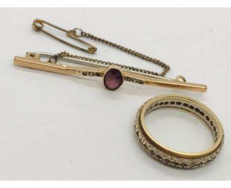 A 9ct gold eternity ring along with a 9ct sweetheart brooch. Total weight 4.5g