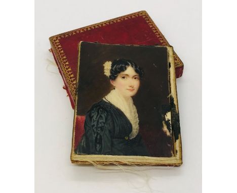 A miniature portrait on ivory of a lady in mourning dress, unsigned. Case A/F