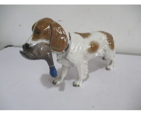 A Rosenthal figure of a gun dog with game bird in its mouth