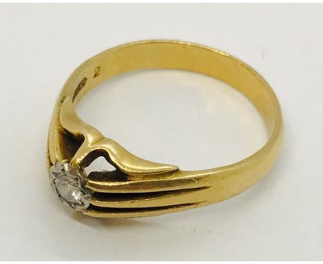 An 18ct gold and platinum gentleman's ring set with a single diamond, 6.2g
