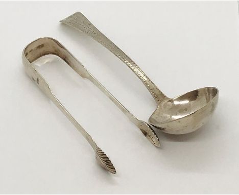 A Georgian silver ladle and a large pair of silver sugar tongs