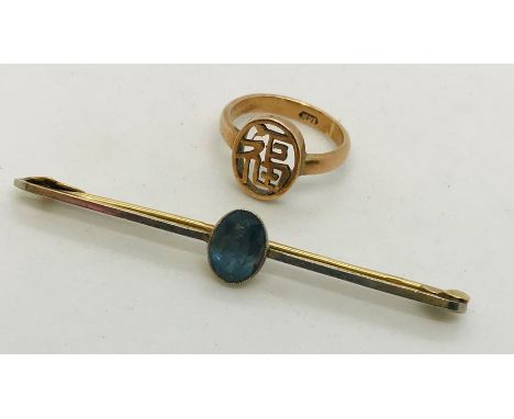 A 15ct gold and platinum bar brooch along with a 14ct gold Chinese ring. Total weight 4.4g