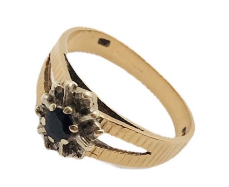 A 9ct gold ring with sapphire and diamonds