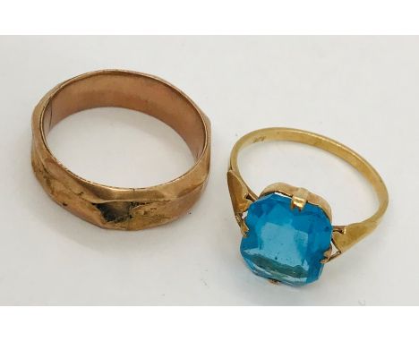 A 9ct gold dress ring with blue stone. Weight 1.9g. Along with a scrap 9ct ring. Weight 1.3g