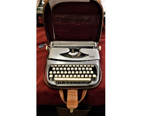 Typewriter-A 'Royalite' Typewriter in brown case (Portable) in working order