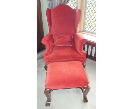 A William and Mary walnut ratchet high wing back elbow chair with arched back, the scroll arms with swept fronts, loose seat 