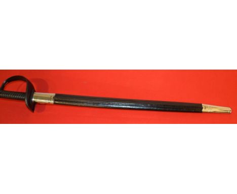 A BRITISH ROYAL NAVY CUTLASS, having black painted slotted hilt and ribbed grip. The 28” (71cm) blade bearing various impress