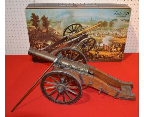 DENIX REF 404 LOUIS XIV REPLICA DESK TOP MODEL CANNON, having metal rimmed rotating wheels and wooden carriage. The embossed 