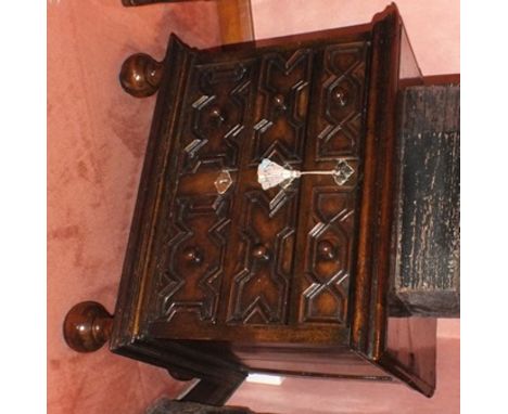 A late 17th century oak chest of small proportions, the rectangular twin plank top with moulded edge, three graduated long dr
