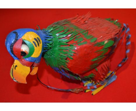 A painted model of an exotic bird 24 cm high