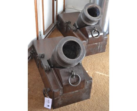 A pair of early 19th century 5.5 inch bronze mortars on teak block carriages with five securing rings, front adjustment wedge