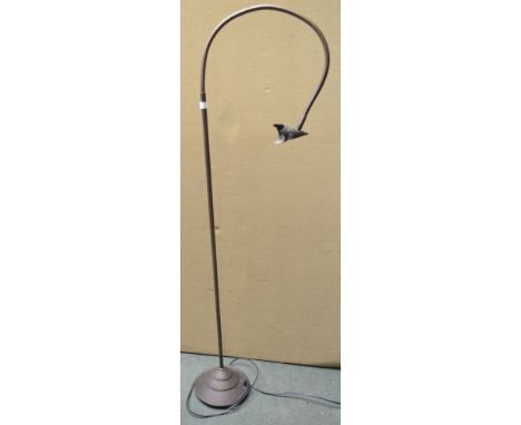 An adjustable standard reading lamp
