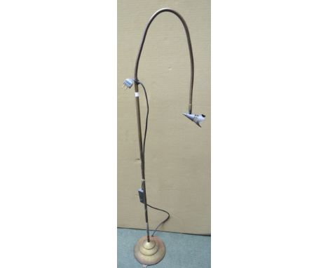 An adjustable standard reading lamp
