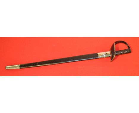 A BRITISH ROYAL NAVY CUTLASS, having black painted slotted hilt and ribbed grip. The 27.5” (70cm) blade bearing various impre