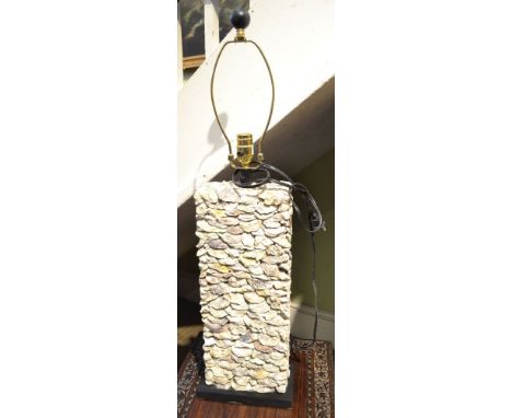 A late 20th century table-lamp, the body encrusted with fossilised shells 52 cm high