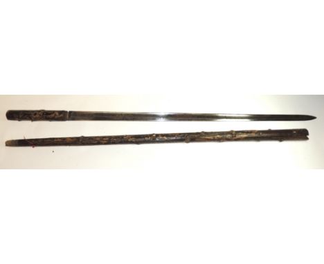 An antique swordstick, the naturalistic stick fitted with straight fullered blade with simple engraved decoration, blade 66cm