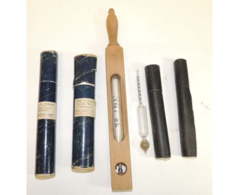 Four specific gravity thermometers in their original canisters and a large thermometer in wooden casing "D Forbes Specificati