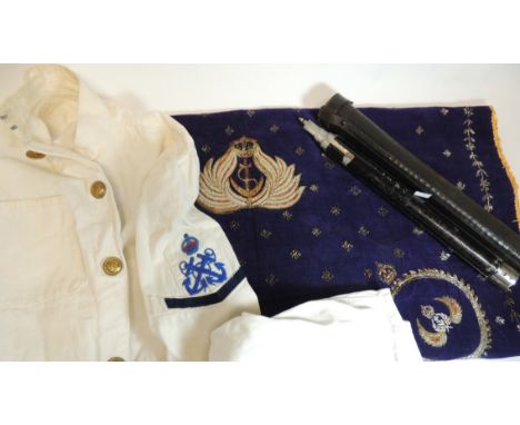 Royal Navy white tunic and shorts, with original brass buttons and cloth insignia; a North African souvenir velvet panel work