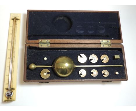 A Sikes Hydrometer no.8412 in original fitted mahogany box also containing Bate, London thermometer ++lacks two weights
